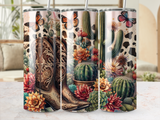 Cowboy boot with desert succulents, cacti, and butterflies on a patterned background.