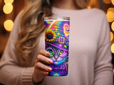 Cat wearing a colorful wizard hat and bow tie on a tumbler.