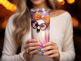 Ghost in glasses holding a pink and purple tumbler with spooky Halloween design.