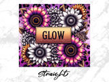 Floral arrangement with "GLOW" in a gold rectangular frame.