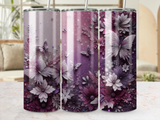 Floral and butterfly design on three tumblers with glitter accents.